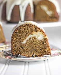 a bundt cake with white icing on a plate