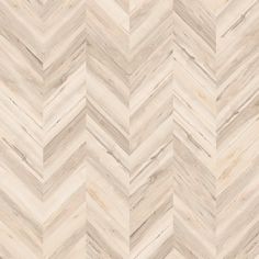 a chevron wood floor with white and beige tones