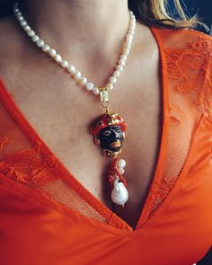 Sicilian necklace handmade from freshwater Pearls (8 mm - 10 mm) and pendant with Ceramic Moor head.  The pendant is made as follows:  - Moor's Head ( 30 mm) in genuine hand-painted Sicilian Caltagirone Ceramic; - River pearls (6 mm), white color; - Natural Coral branches, red color;  - Large Baroque Pearl pendant (18 mm), white color.  Stainless Steel lobster clasp closure.  Total necklace length : 49.50 cm * SHIPPING * Your order will be shipped within 1-3 business days from your purchase. You Artisan Pearl Pendant Necklace, Single Strand Pearl Pendant Necklace, Artisan Necklace With Pearl Charm As Gift, Unique Pearl Charm Pendant Necklace, Unique Pearl Pendant Necklace With Charm, Single Strand Pearl Pendant Necklace As Gift, Single Strand Pearl Pendant Necklace For Jewelry Making, Single Strand Pendant Beaded Necklace, Baroque Pearl Pendant