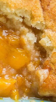 a close up of food on a plate with some sort of bread and sauce in it