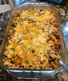 a casserole dish with meat and vegetables in it on a kitchen counter top