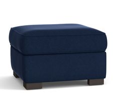 a blue footstool sitting on top of a white floor