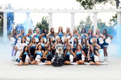 a group of cheerleaders posing for a photo