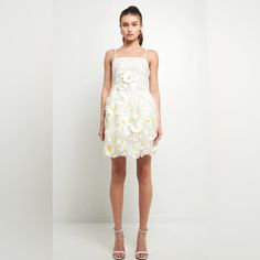 Discover The Perfect Blend Of Femininity And Edge In This Floral Embroidered Mini Dress. Crafted From A Light And Airy Fabric This Mini Length Dress Is Designed To Fit And Flatter Your Figure With Adjustable Shoulder Straps For Personalized Comfort. Show Off Your Style With This Eye-Catching Look. New With Tags Inventory #P2082 Sleeveless Summer Dress With 3d Flowers, Spring Wedding Mini Dress With Floral Applique, Yellow Mini Dress For Spring Wedding, Spring Wedding Yellow Mini Dress, Summer Wedding Dresses With 3d Flowers, White Party Dress With 3d Flowers, Yellow Floral Applique Party Dress, Yellow Dresses With Floral Applique For Party, Yellow Party Dress With Floral Applique