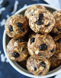 a bowl filled with oatmeal and raisins on top of a table