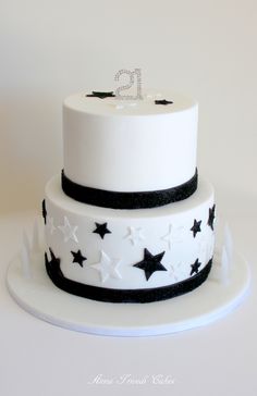 a white and black cake with stars on it