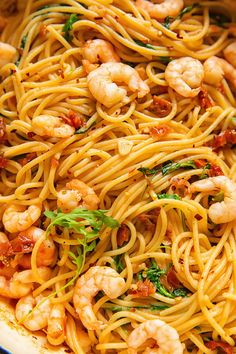 pasta with shrimp and spinach in a pan