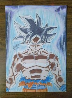 a drawing of gohan from dragon ball is shown on a wooden table with blue and white background