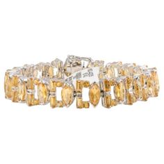 Art Deco Citrine Gemstone Bracelet for Women in sterling silver showcases endlessly sparkling natural citrine, weighing 17.6 carat. It measures 7 inches long in length. Citrine stimulate concentration and reduces stress. Designed with perfect mix cut Citrine set in continuation in prong setting in sterling silver to make you stand out on any occasion or event. The elegant style complements the attire beautifully and is a perfect Engagement Gift, Bridal Shower Gift, Grandma Gift, Gift For Sister, Luxury Multicolor Citrine Jewelry, Elegant Adjustable Citrine Bracelets, Fine Jewelry Citrine Multi-stone, Elegant Faceted Citrine Bracelets, Luxury Adjustable Citrine Bracelet, Perfect Engagement Gifts, Bracelet Art, Vintage Tennis, Bracelet Tennis