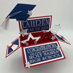 an open graduation card with congratulations written on it and stars in red, white and blue