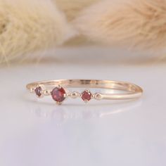 Minimalist small & dainty 14k rose gold 3 stone garnet promise ring for her, Unique delicate womens garnet engagement ring,Gift for her ring WE OFFER UNLIMITED PERIOD INSTALLMENTS PLAN This is a beautiful, stunning, feminine ring that works well for all occasions, styles, and ages. You will love it! Ring information: Stones: Garnets Approximate size: 2.5mm (1 stone) Approximate size: 1.5mm (2 stones) Metal type: Gold Metal stamp: 14k Gold Installment Payments We offer installment payments fo Garnet Engagement Ring, Promise Ring For Her, Art Deco Wedding Band, Her Ring, Tiny Rings, Fancy Gifts, Promise Rings For Her, Cz Ring, Garnet Rings