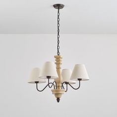 a chandelier with five lamps hanging from it