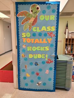 a classroom door decorated with sea animals and the words, our class totally rocks dude