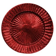 a red glass plate sitting on top of a white table