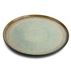 a green and brown plate on a white background