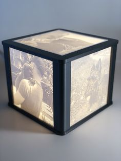 a cube shaped light box sitting on top of a table