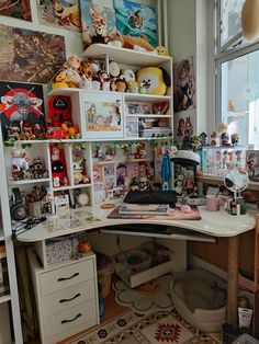 a home office with lots of clutter on the desk and shelves full of stuffed animals