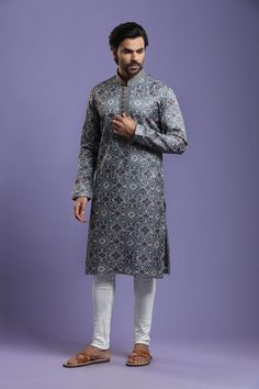 Grey kurta with bandhani print in floral motifs & front potli placket Kurta Set Traditional  Wear  Care Instructions: Dry Clean Blend Slik Fabric with Touch of Stitch Line  Top Details: Color- Grey, Fabric - Blend slik Bottom Details Color - Cream, Style - free size Chudidar, Fabric -Dhupion Silk Package Include: Kurta and Pajama Additional Information : - As this Sherwani/Waistcoat/Kurta is stitched & made as per orders requested only, So there is NO RETURN & NO EXCHANGE on this product. Kindly Festive Straight Kurta With Kalamkari Print, Transitional Season Straight Kurta With Traditional Patterns, Traditional Bandhani Wear For Eid, Eid Traditional Wear With Bandhani Print, Eid Bandhani Traditional Wear, Transitional Season Traditional Pattern Straight Kurta, Straight Kurta With Printed Motifs For Transitional Season, Traditional Festive Kurta With Bandhani Print, Traditional Pattern Sherwani For Puja