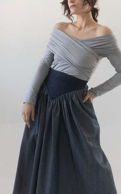 This is already a favourite piece of mine. such a perfect statement skirt. with this season i really wanted to play around with the different sides of denim. i think the dark waistband gives the skirt an extra detail that is really flattering as well. features two pockets and a side zipper closer. item is made to order with a three week wait period. but because of this if you are in between sizes please send me a message with the exact measurements you would like me to make the skirt in. here it is shown as a midi length but if you would prefer a different length again just message me!    100% cotton denim    hand wash cold or dry clean only    made in montreal Fitted Asymmetrical Denim Skirt For Spring, Fitted Denim Midi Skirt For Fall, Fitted Asymmetrical Denim Skirt For Fall, Fitted Flared Denim Skirt For Fall, Fitted Cotton Denim Skirt In Elegant Style, Elegant Fitted Cotton Denim Skirt, Elegant Fitted Denim Skirt, Fitted Denim Blue Midi Skirt, Fitted Blue Cotton Wrap Skirt