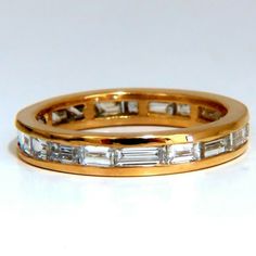 2.20.Ct. Natural Diamonds Eternity Baguette Ring. G-Color Vs-2 Clarity. Ring: 3.8mm Wide Depth 2.4mm 14kt. Yellow Gold. 3.8 Grams Size 8.5 $8000 Appraisal Certificate To Accompany. Resizing Service Is Not Available. Luxury Baguette Diamond Eternity Band For Anniversary, Gold Eternity Band With Baguette Diamonds, Yellow Gold Eternity Band With Baguette Diamonds, Luxury Yellow Gold Eternity Band Channel Set, Luxury Yellow Gold Baguette Cut Eternity Band, Classic Yellow Gold Eternity Band With Baguette Diamonds, Gold Eternity Band With Baguette Diamonds For Anniversary, Pave Wedding Rings, Tanzanite Diamond Ring