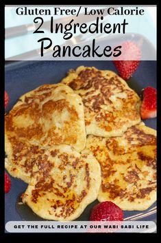 gluten free / low calorie 2 ingredient pancakes on a blue plate with strawberries