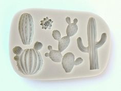 a cookie mold with cactus and cacti on it