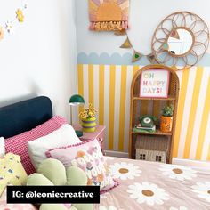 a bedroom decorated in pink, yellow and white with flowers on the bed coverlet