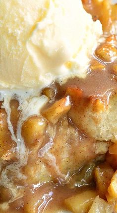 a close up of food on a plate with potatoes and gravy next to ice cream