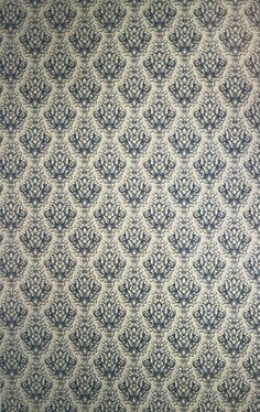 an old wallpaper with blue and white designs