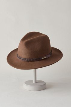 A handsome fellow, the Sierra crushable wool safari hat exudes an elegant yet rugged Western style. Sierra is crafted from premium lightweight wool felt and detailed with a stitched leather hatband. Sierra's breathable wool construction will resist bad weather, and its flat brim will shield your eyes from the sun. Inside, a moisture-wicking sweatband keeps it secure on your head. The always-reliable Sierra packs right up and easily stows away, but when called upon, Sierra is always ready to rega Brown Leather Fedora For Fall, Leather Fedora Felt Hat For Outdoor, Brown Hat Bands For Winter Travel, Winter Leather Travel Hat, Brown Wool Fedora For Outdoor, Leather Hats For Travel In Fall, Leather Felt Hat With Short Brim For Outdoor, Brown Felt Hat For Winter Travel, Leather Travel Hat For Fall