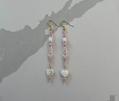 Dainty dangly heart chain earrings! Pearly hearts and beads with pink accents on gold hooks and wire, about 3.5 in. Pink Beaded Chain Dangle Earrings, Gold Hooks, Heart Chain, Handmade Jewelry Diy, Pink Accents, Pink Earrings, Chain Earrings, Jewelry Diy, Heart Earrings