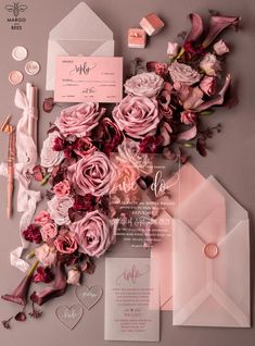 wedding stationery with pink flowers and calligraphy