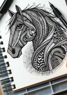 a drawing of a horse with intricate patterns on it's face and manes