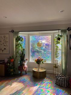 a living room filled with furniture and windows covered in sun shining through the window blinds