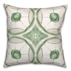 a green and white pillow with circles on it