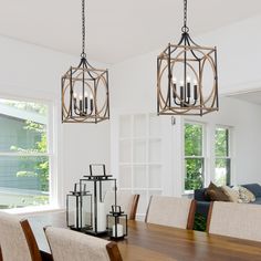 a dining room table with chairs and chandelier