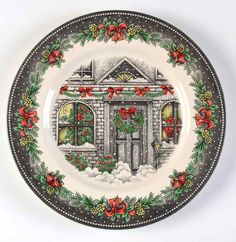 a christmas plate with holly wreaths and bells on the front is decorated in red, white and green