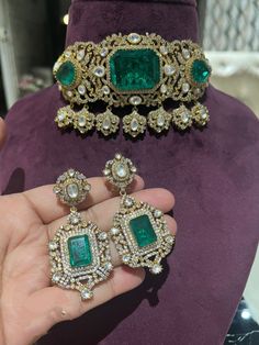 Sparkly Emerald Doublet Gold CZ Choker with AAA quality CZ stones and fine Kundan. Once you watch the video you will know how beautifully the set has been Crafted This necklace comes with Earrings. Necklace Has adjustable Dori . Earrings Have Pushbacks . This choker has global appeal and represents elements of Indian, Pakistani as well as Punjabi Jewelry 18 K b rhodium plated Earrings Closure: Pushback Necklace has Dori/Cord chain for adjustability Highest quality and craftsmanship Customized or Punjabi Jewelry, Pearl Necklace Designs, Necklace Indian, Kundan Necklace, Bollywood Jewelry, Semi Precious Jewelry, Kundan Necklaces, Necklace Choker, Jewelry Business