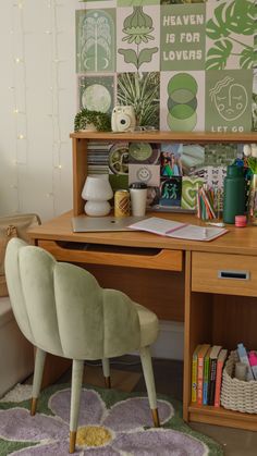 a wooden desk topped with a green chair next to a book shelf filled with books