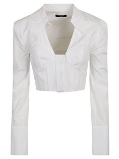 This white cotton cropped shirt from Balmain highlights a structured bustier-style neckline with seam detailing. Long sleeves are accented with embossed gold-tone buttons, adding to its sophisticated appeal. Perfect for crafting chic outfits that make a statement on special occasions.

- White cotton fabric
- Cropped design
- Structured bustier-style neckline
- Seam detailing
- Long sleeves
- Embossed gold-tone buttons Balmain Shirt, Balmain Top, Denim Shirt Men, Cropped Shirt, Clothing Hacks, Crop Shirt, Evening Wear, White Cotton, Fashion Inspo Outfits