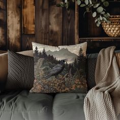 a couch with a pillow on top of it next to a potted plant and wooden wall