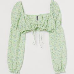 H&M Light Green Floral Crop Top Size Xs New With Tags Gathered, Extra-Short Crop Top In Woven Fabric. Narrow, Concealed Elastic At Top And At Hem. Gentle V-Neck At Front With Ties, Long, Voluminous Sleeves With Smocked Seams At Upper Arms, And Concealed Elastic At Shoulders And Cuffs. Size Xs Material Content Polyester 98%, Spandex 2% Smoke Free Home Royal Blue Lace, Purple Crop Top, Boho Crop Tops, Satin Crop Top, Graphic Crop Top, Womens Halter Tops, Sequin Crop Top, Bralette Crop Top, Blue Crop Tops