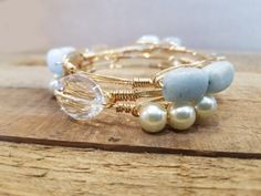 This set features large clear crystals, aquamarine nuggets, and pearls. Uga Jewelry, Bangle Outfit, Blue Is My Favorite Color, Leather Jewelry Bracelet, Florida Jewelry, Stackable Bangles, Pearl Bangle, Bangle Bracelet Set, Crystal Bangle