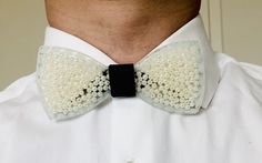 Resin Bow tie for men and women. This bow tie is made from resin with beads inserted inside. The bow tie is pre-tied and adjustable so that it fits all sizes.  * Please note bow ties may slightly vary from picture as they are a handmade-product and not factory made, therefore unique and individual. White Formal Bow Tie With Butterfly Knot, Formal White Bow Tie With Butterfly Knot, Formal White Bow With Butterfly Knot, Adjustable White Bow For Black Tie Occasion, White Dapper Bow Tie For Party, Dapper White Bow Tie For Party, Dapper White Adjustable Bow Tie, Dapper Adjustable White Bow Tie, White Bow Tie For Gifts