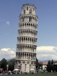 a very tall tower with people standing around it