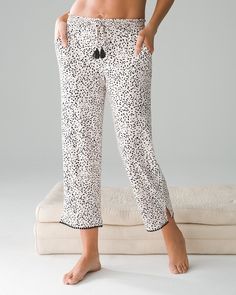 Why you’ll love it: Nearly 40% of women have trouble sleeping because they get hot or sweaty.* That’s no way to live! Our exclusive Cool Nights® PJs always feel cool and comfy against your skin for the best night’s sleep. These cropped pajama pants are edged in pom-pom trim for added style.. Comfortable style from Soma Intimates. Comfortable style with Soma Intimates. Details Cool Nights® fabric is made with lightweight rayon fibers that stay cool to the touch and keep the fabric from stick White Comfortable Sleepwear, Comfortable Long Pants Sleepwear, Comfortable Summer Bottoms For Bedtime, Comfortable Summer Bedtime Bottoms, Comfortable Spring Sleepwear For Lounging, Comfortable Long Pants Sleepwear For Pajama Party, Comfortable Sleepwear With Elastic Waistband, Comfy Relaxed Fit Bottoms For Pajama Party, Comfortable Summer Pants For Pajama Party