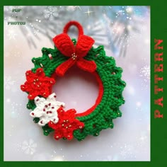 a crocheted christmas wreath ornament with red and white flowers on it