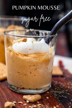 pumpkin mousse sugar free dessert in a small glass on a wooden board with text overlay