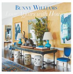 the front cover of bunny williams's love affair with houses, featuring blue and white furniture