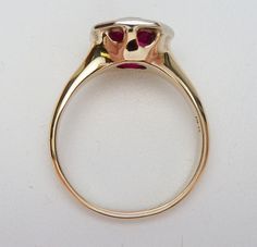 This is a very old and classic birthstone ring. This ring has a European cut round synthetic red stone in the center (most likely synthetic spinel but I don't have a way to test it) that measures 8.5 mm. The stone is set in a hexagonal white gold plate that is welded to a yellow gold shank. The ring is stamped 14K and weighs 3.6 grams. The ring is a size 6. This is such a classic item and it's in very good condition. The ring has been polished up a bit and looks almost new. Cute Accessories, Red Stone, Birthstone Ring, Solitaire Ring, The Stone, Birthstone, Cocoa, The Ring, Gold Plate